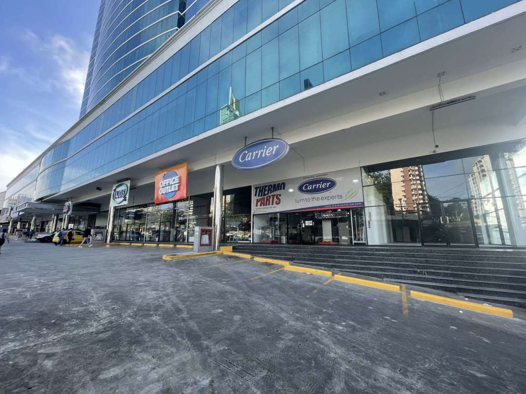 Modern commercial tower exterior with multiple retail stores like Carrier visible at Century Tower Panama City