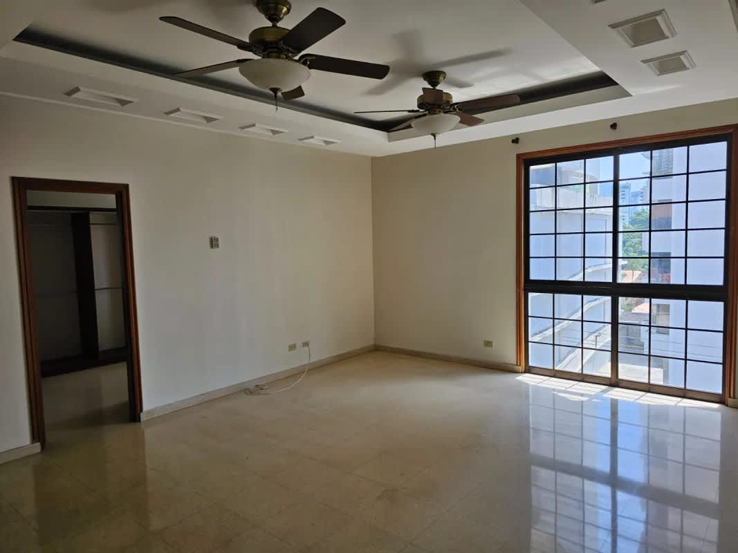 Indoor pool space with tile flooring and lounge area at PH Ariadne Panama City