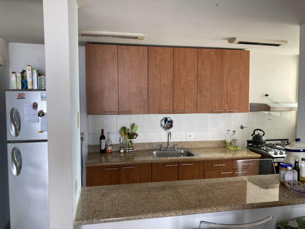 Child's bedroom with oceanfront view window, blue accent wall PH Terramar Panama