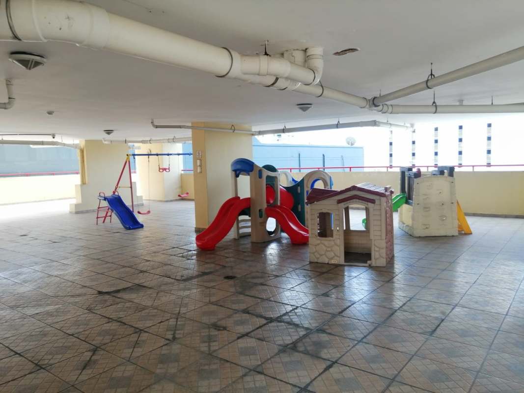 Apartment kitchen with breakfast bar, stools, stainless appliances at PH Marquez Via España