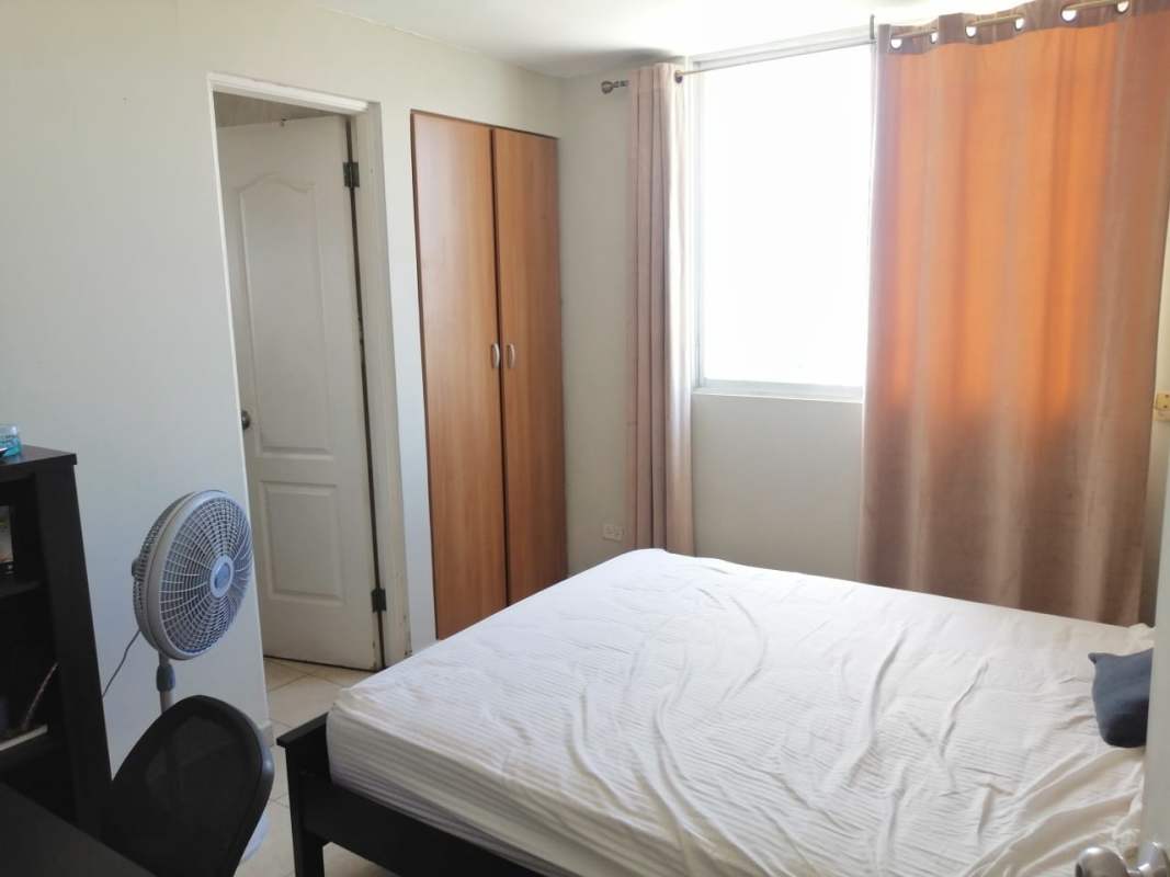 Bedroom with large window, wardrobe, minimalist style in PH Marquez Panama City