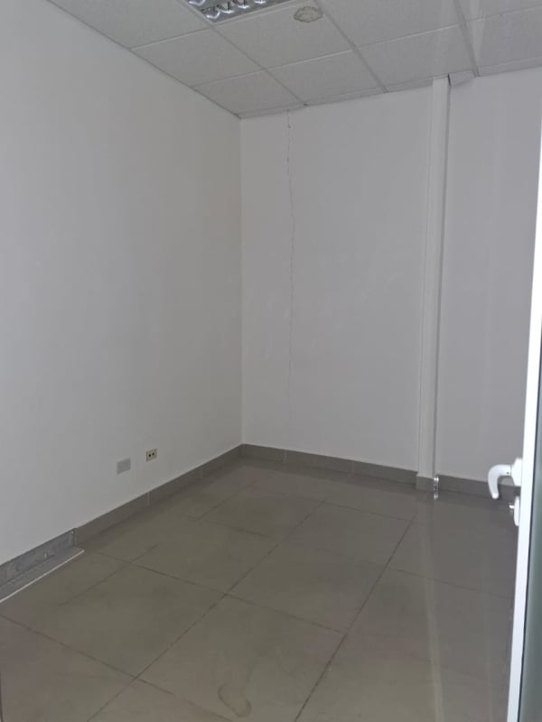 Small interior space tiled and wired as storage or server room at Plaza Korintho Panama City
