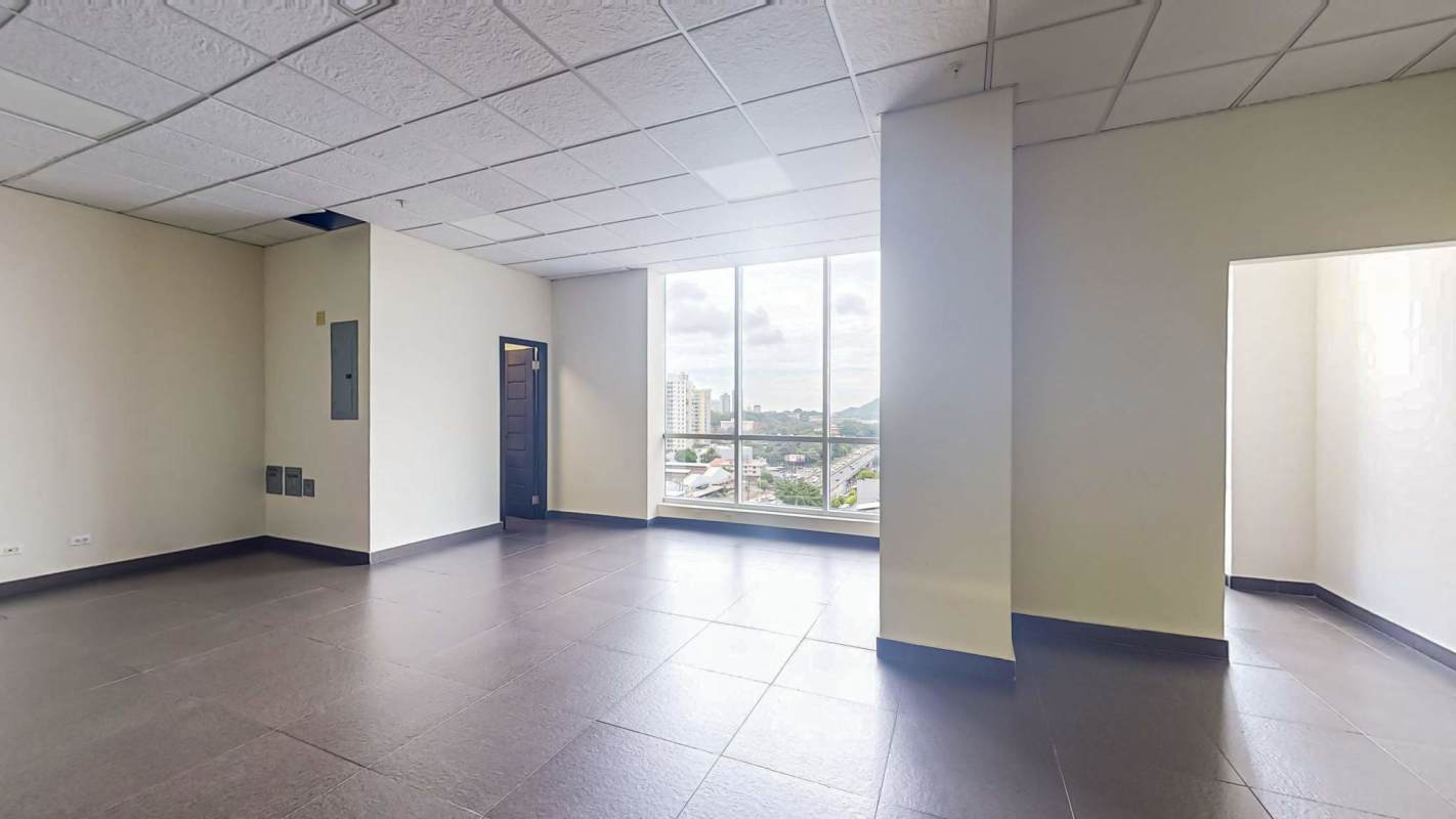 Modern office space with glass partitions and large windows at PH Edison Corporate Center Panama City