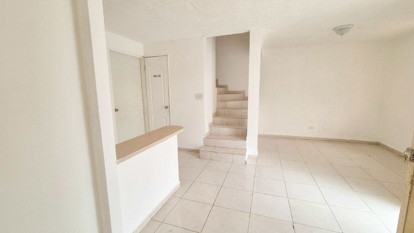 Minimalist bedroom ceramic floor window duplex home Villas del Naranjal Panama