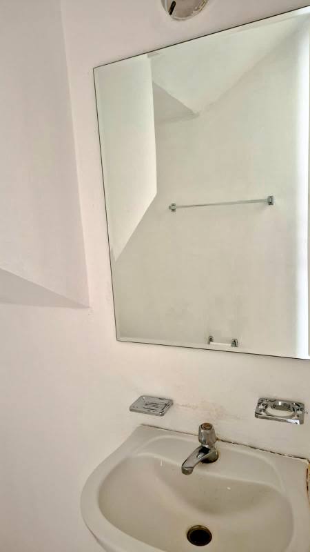 Compact kitchen with white cabinetry, tile floor duplex Villas del Naranjal Pedregal Panama