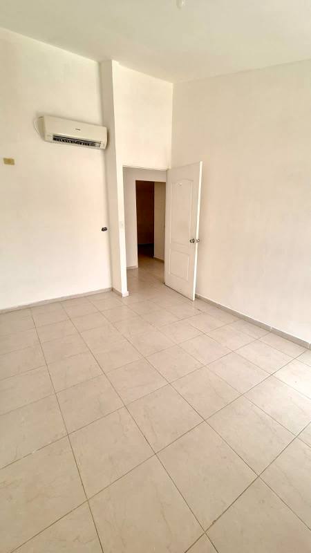 Modern bathroom with glass shower partition, sink and toilet in duplex Pedregal Panama