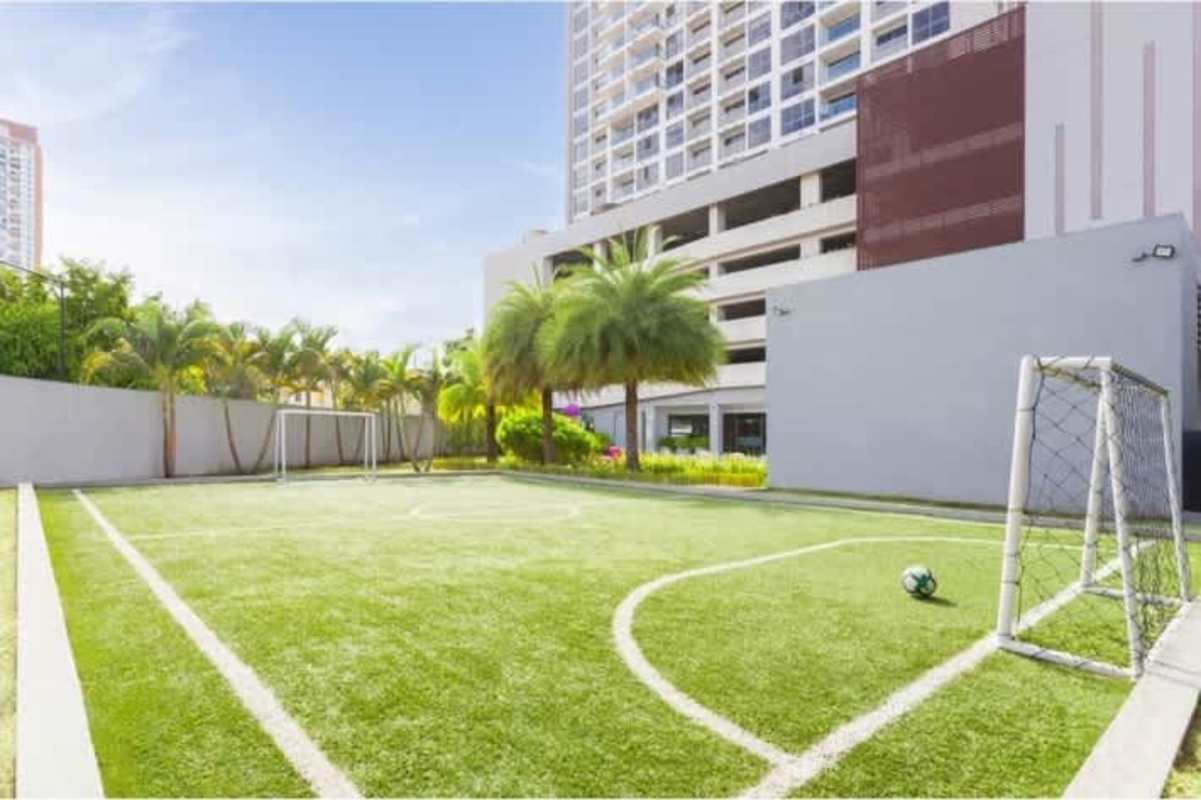 Modern outdoor pool with sun loungers in Altavista Tower Betania Panama