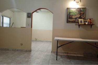 Residential property street view with fence driveway trees and neighboring houses Villa Dora 2 David Chiriquí