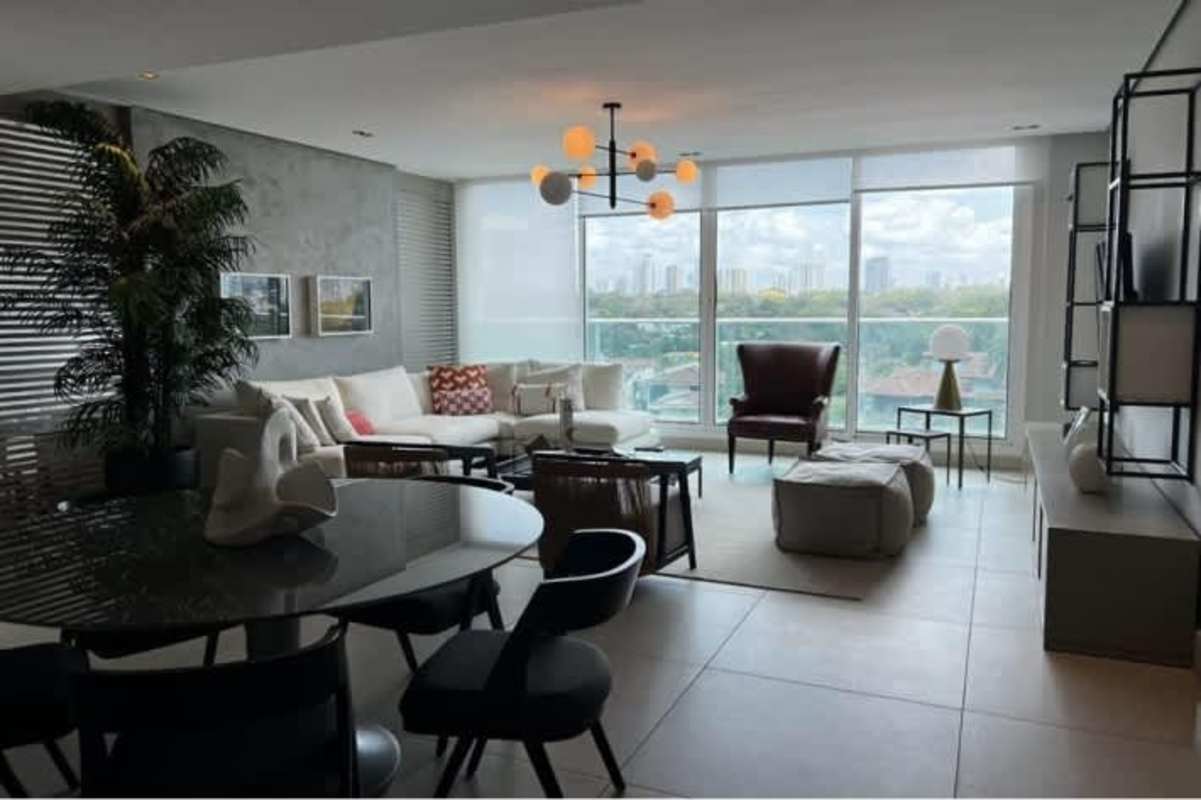 Living room with floor-to-ceiling windows, panoramic skyline view, modern furnishings at PH Riviera del Golf