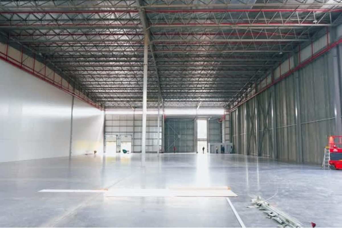 Empty interior of industrial warehouse with high ceilings and steel beams in Panama City