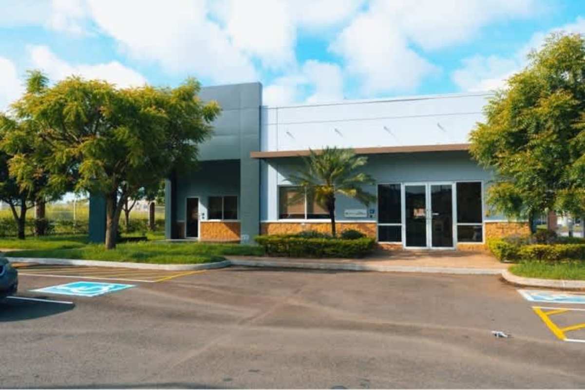 Exterior parking lot and warehouse glass entrance at Panama Logistics Park Tocumen Panama