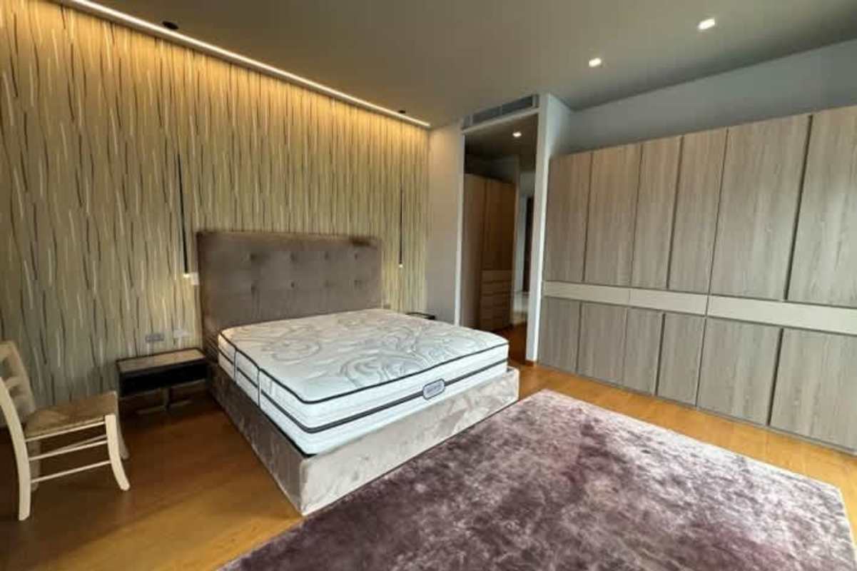 Spacious modern bathroom with marble walls and double vanity in Ocean Reef Islands apartment Panama City