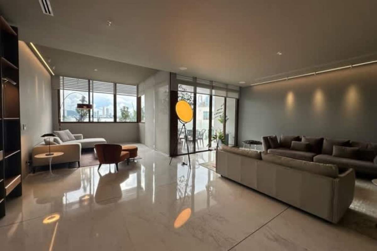 Spacious living room with marble floors and ocean views in luxury apartment on Ocean Reef Islands Panama City