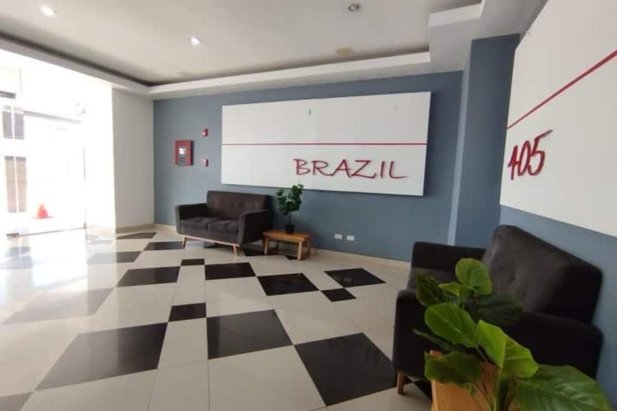 Modern lobby reception with seating and signage at PH Brazil 405 Panama