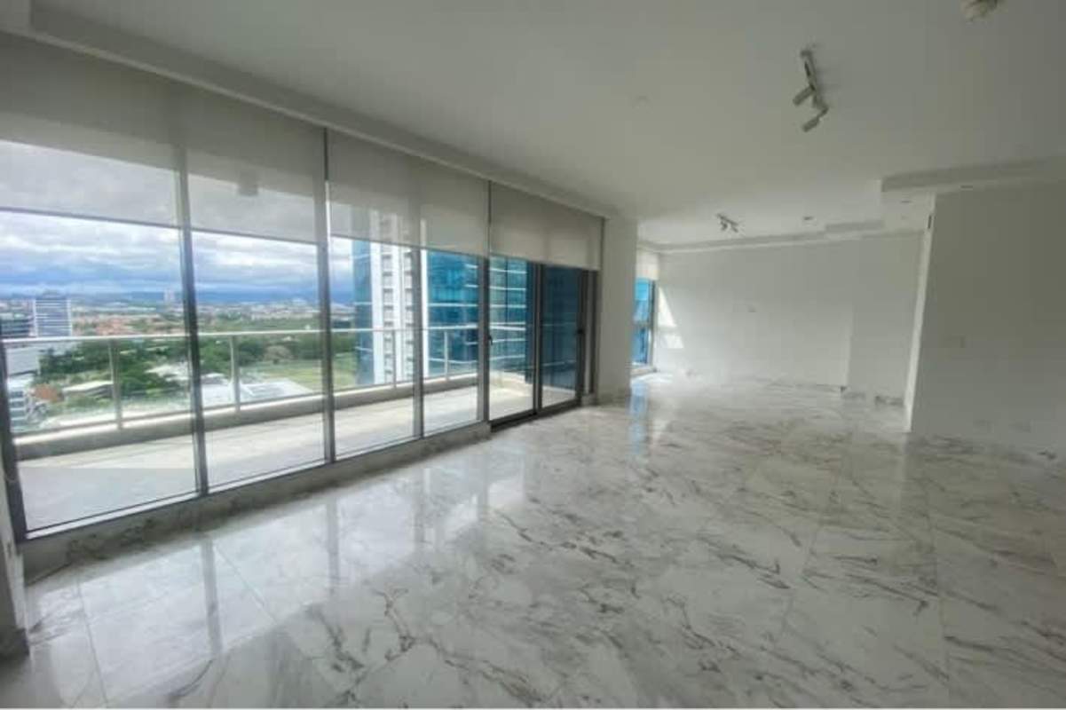Open living and dining area with marble floors and balcony Costa del Este Panama