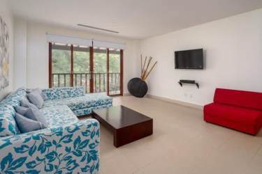 Open plan living and dining room fully furnished in Buenaventura Resort loft