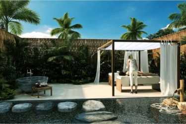 Modern fitness center with large windows overlooking ocean at Playa Caracol Punta Chame Panama