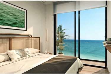 Modern bedroom with panoramic ocean view windows in Playa Caracol beachfront condo Punta Chame Panama