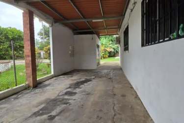 Traditional kitchen with wood cabinets, adjacent dining area Coronado Panama