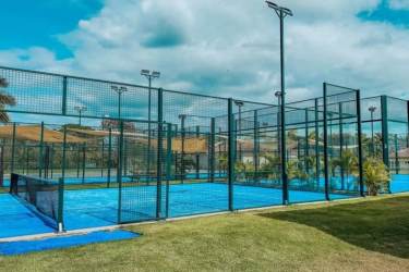 Padel tennis courts surrounded by palm trees in Buenaventura Resort, Panama