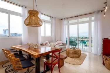 Gourmet kitchen with island, stainless appliances, natural lighting in Buenaventura luxury condo Panama