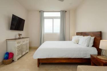 Guest bedroom in marina condo with ensuite bath farmhouse decor Buenaventura Panama