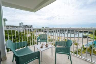 Bedroom with king bed, marina view balcony access in Buenaventura marina condo Panama