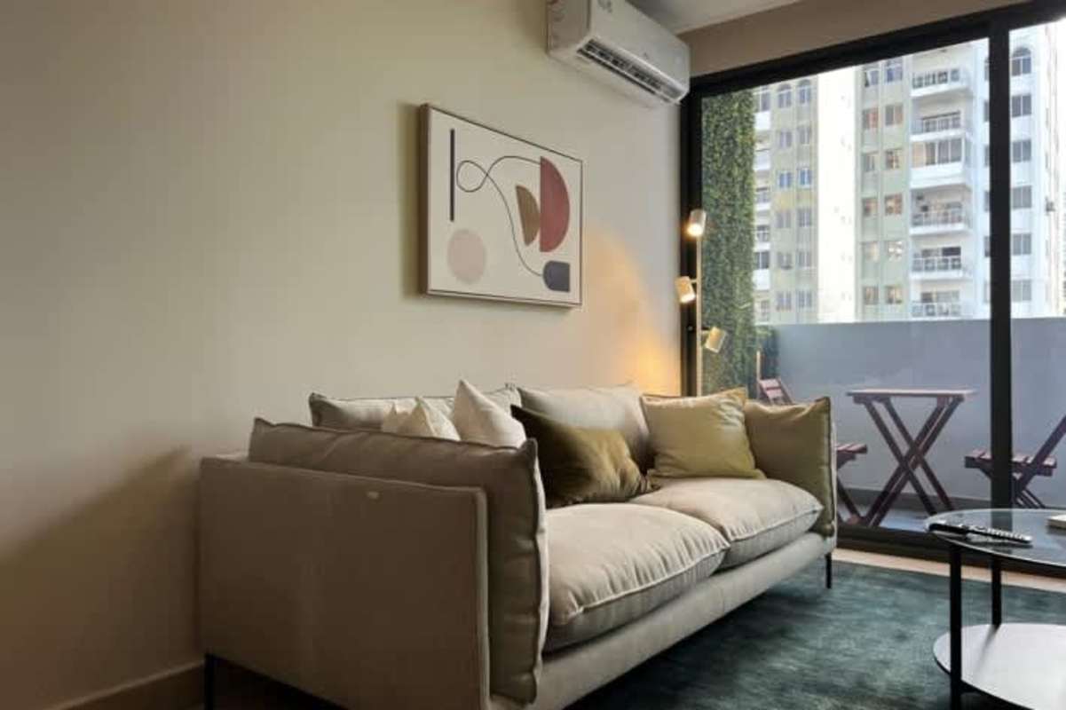 Contemporary apartment with minimalist workspace, stylish kitchen, art decor, at PH Park View San Francisco Panama