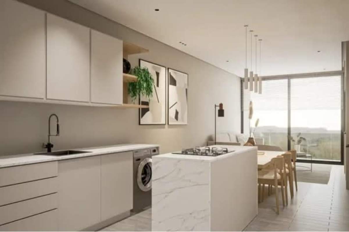 Modern minimalist kitchen and dining area open layout at PH The Edge Marbella Panama