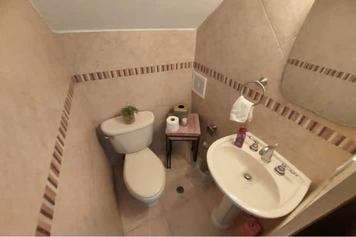 Wooden stairs with modern glass railing in Panama house for sale Green Valley