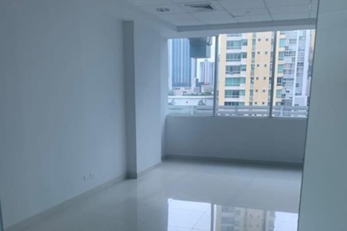 Commercial hallway with glossy tiled floor, glass partitions, city skyline through windows PH Century Tower Panama