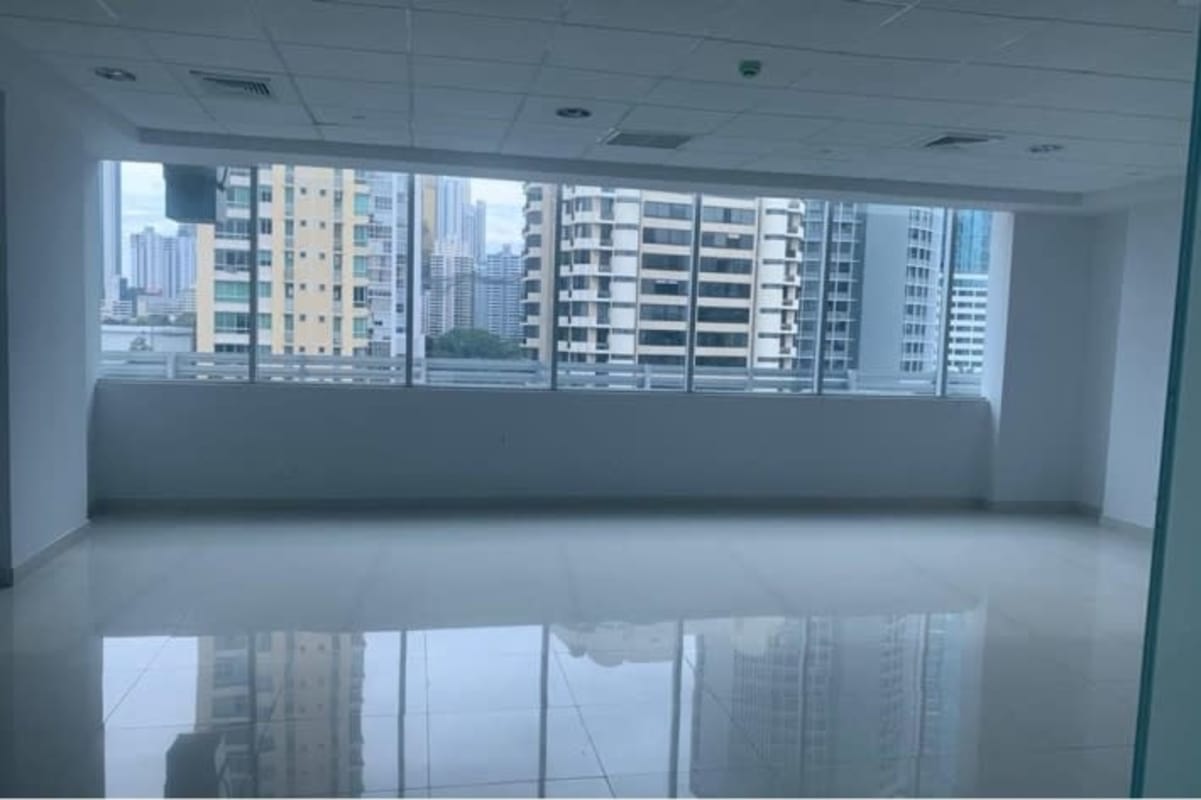 Empty office space with floor-to-ceiling windows tiled floor Panama City PH Century Tower