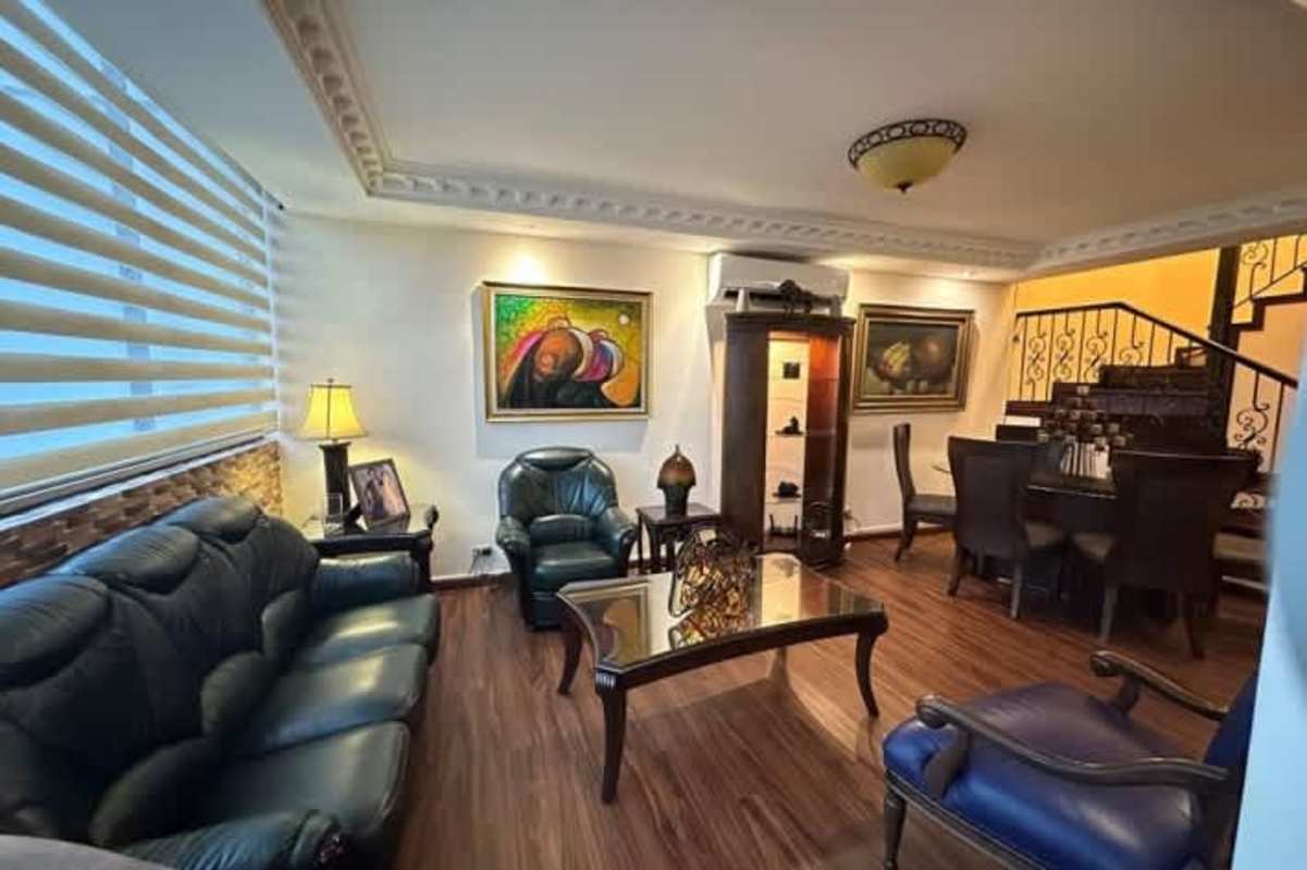 Modern kitchen in PH Bahia Azul with granite countertops, wooden cabinets, and appliances in Panama City