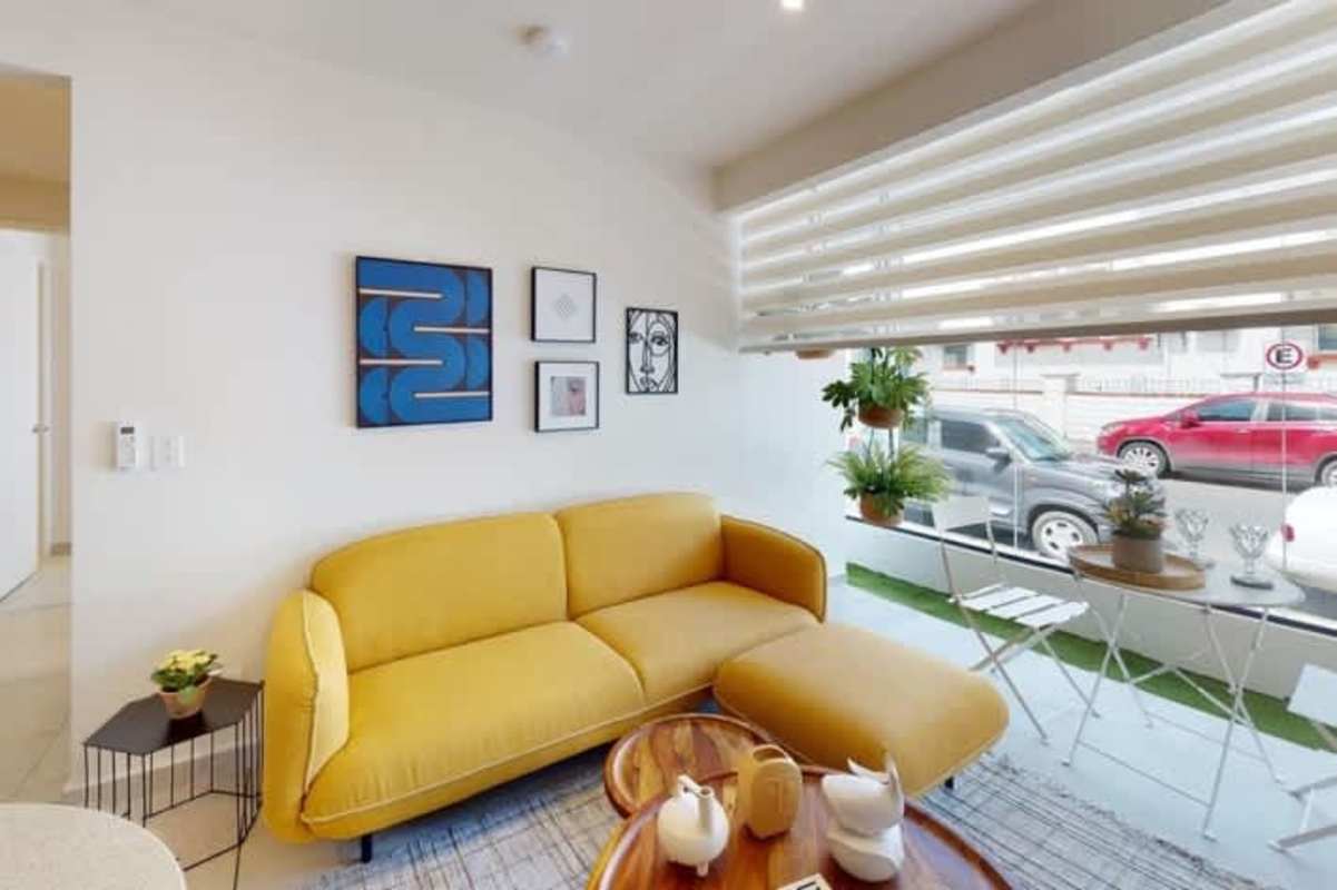 Modern compact kitchen with wood cabinetry and stone countertop PH Bella Vista Residences Panama City