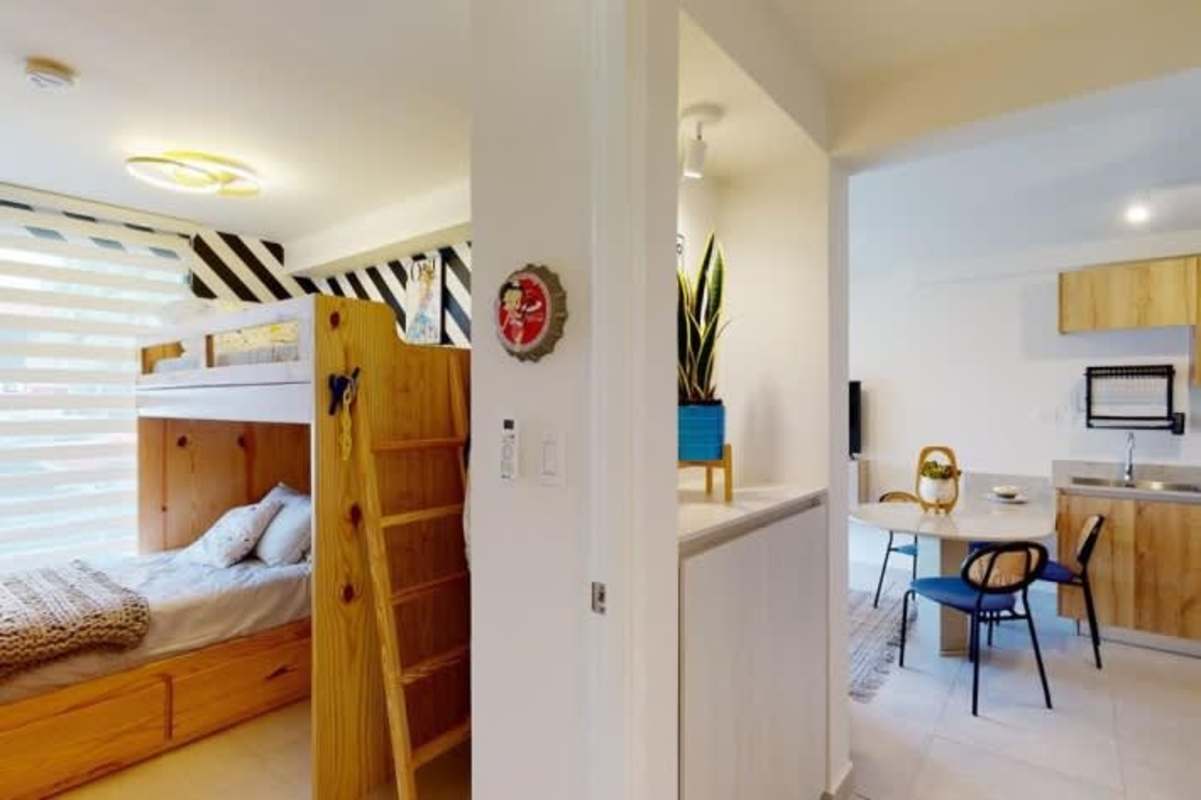 Bright bedroom area with large window and modern finishes PH Bella Vista Residences Panama