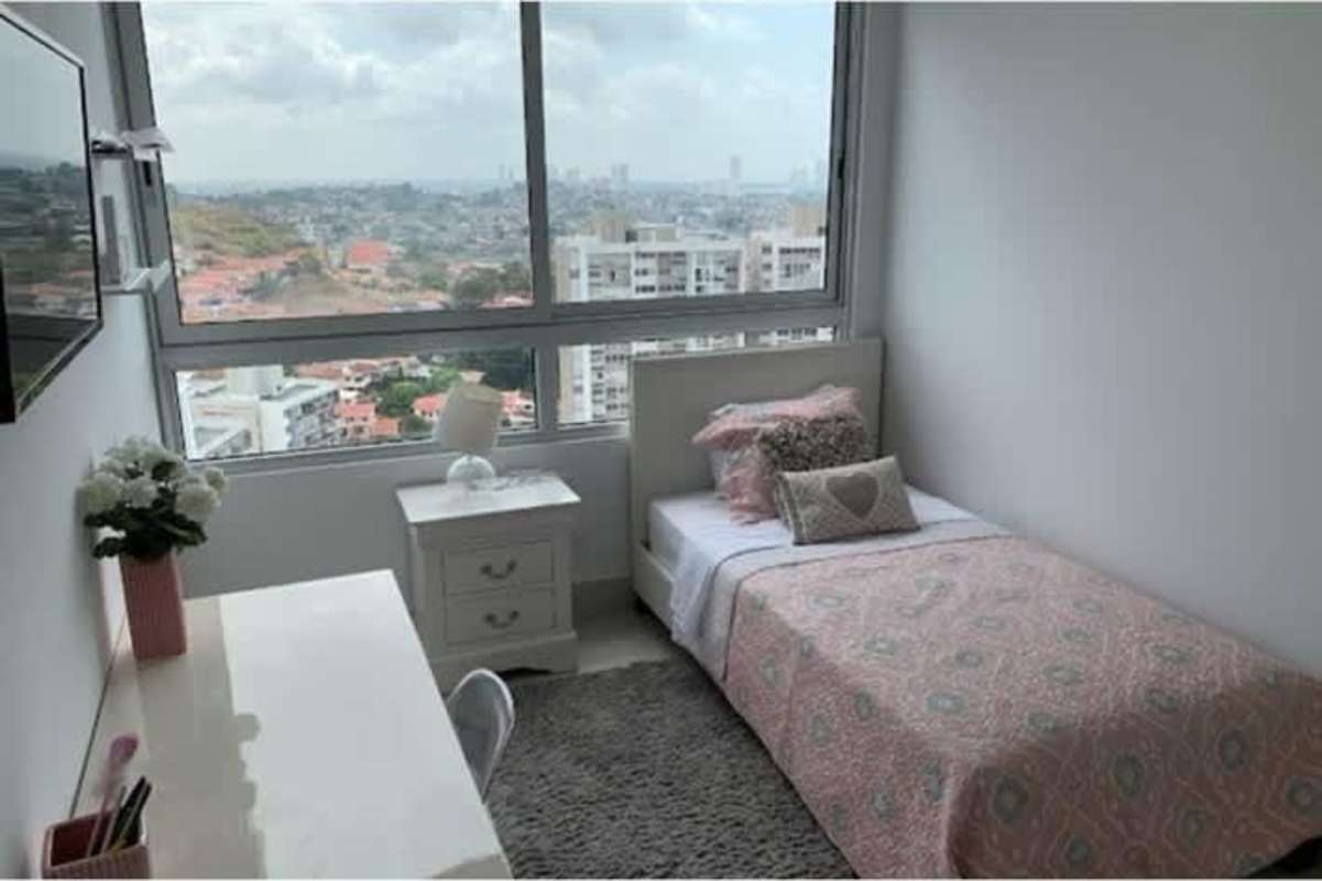 Bedroom with large window cityscape views minimalist design in PH Greenwood Towers Panama