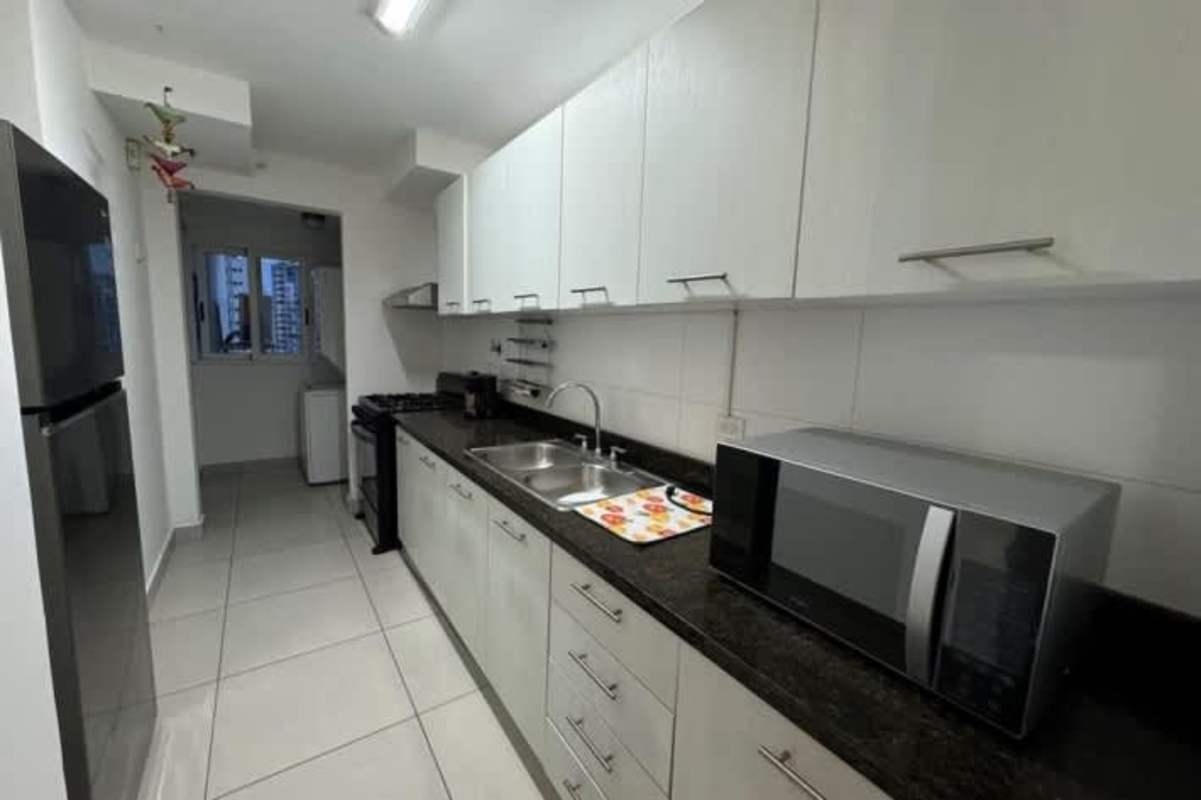 Large master bedroom with built-in closets and window with skyline view in PH San Francisco Bay Panama