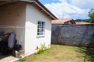Side garden and fenced yard in affordable single-family house in Panama