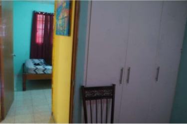 Bedroom space with tiled floor and wardrobe in house for sale in Montelimar La Chorrera Panama