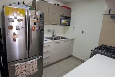 Bright bedroom with window, en-suite bath and walk-in closet in PH Madeira apartment Panama Pacifico