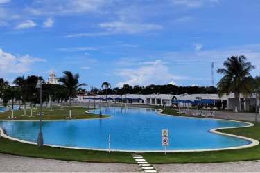 Spacious covered outdoor patio with lounge furniture at Ibiza Beach Residences Rio Hato