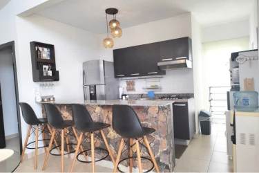 Equipped kitchen with granite countertops, wood cabinets in Rio Hato beach house