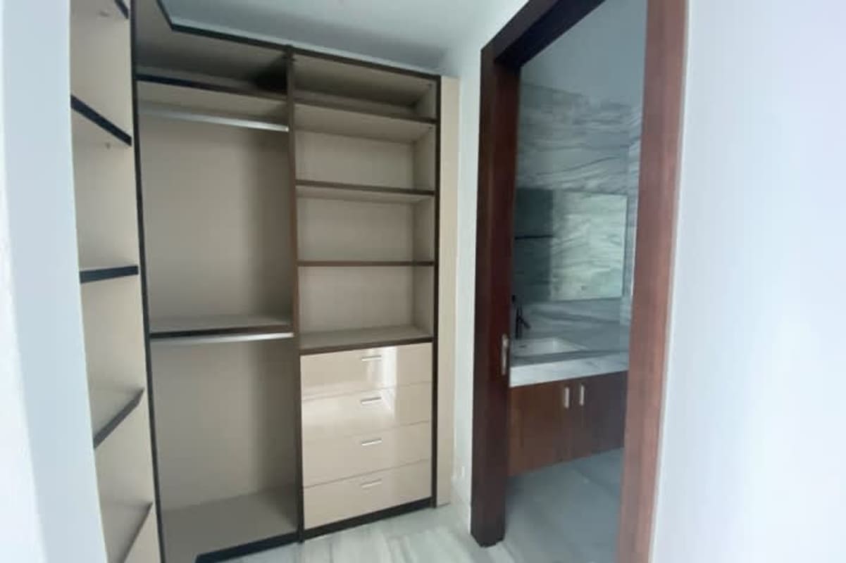 Luxury condominium lobby with handcrafted decor chandeliers seating The Towers Punta Paitilla Panama