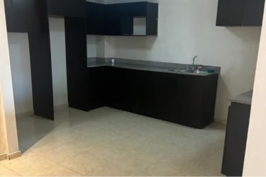 Front exterior of house with arched gates stone accents and tiled roof La Arboleda