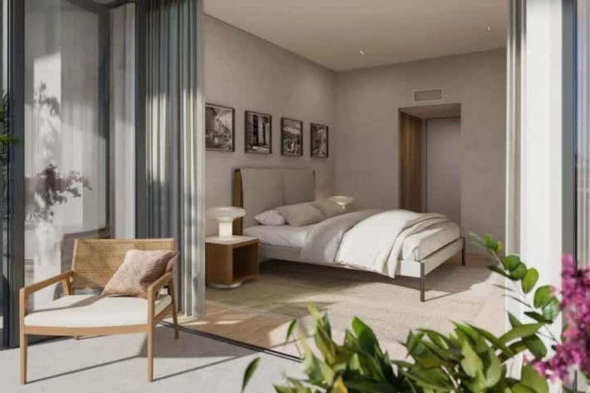 Modern bedroom with glass doors to balcony, neutral décor, ocean view at Passage Amador Panama