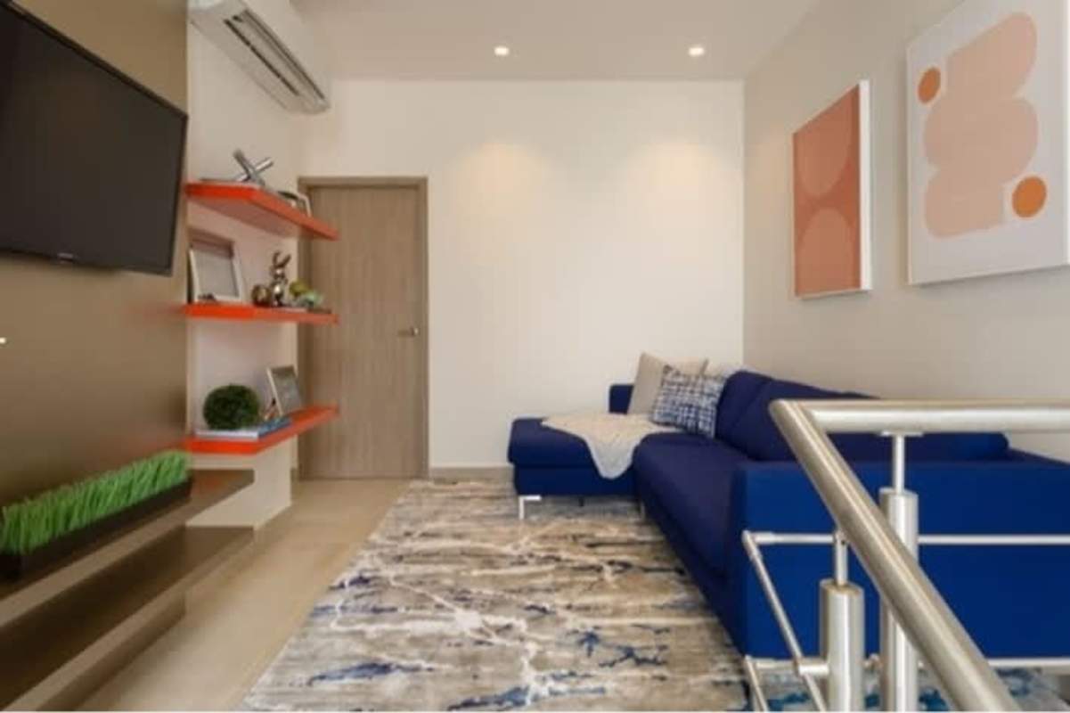 Bedroom with natural light, modern decor, upholstered bed in Costa Sur Panama