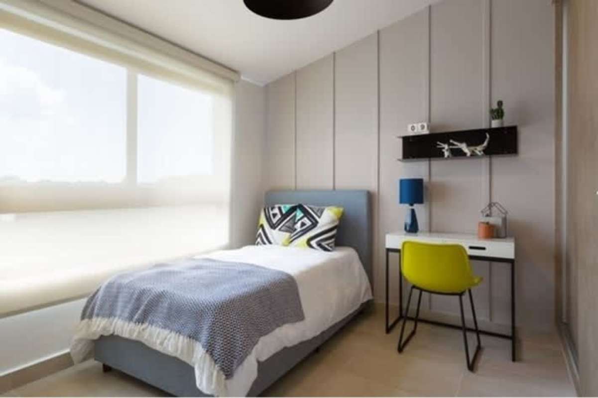 Minimalist bedroom with neutral decor and large window in Costa Sur house Panama City