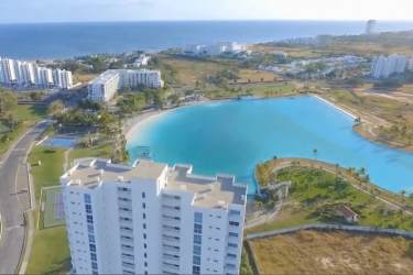 View from Playa Blanca Condo with ocean beach lagoon and palm trees in Panama