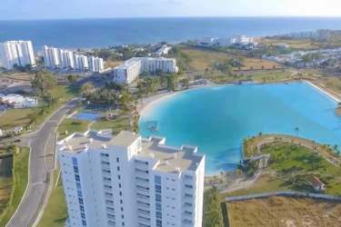 High-rise condominiums facing giant lagoon pool in Playa Blanca Resort Panama
