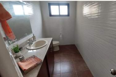 Bright open-plan living and dining area with balcony access at PH Las Olas II, San Carlos Panama